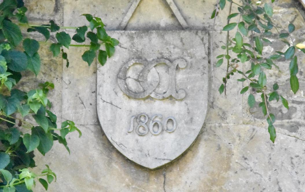 Stone crest above the doorway to a house in the village